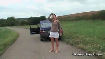 Young Girl Entices Elderly Man During A Drive