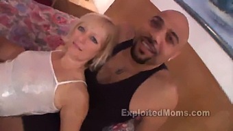 A Middle-Aged Blonde Woman Engages In Sexual Intercourse With A Large Black Penis In A Heated Video